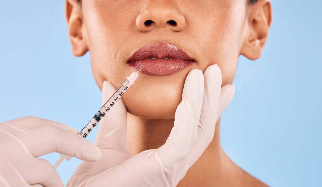 Woman receiving Botox injection in upper lip